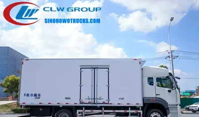 Rear view of the 15 ton reefer truck with large sliding doors and refrigeration unit mounted on the skirt