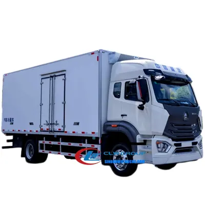 Side view of the refrigerated van showing FRP cladding, stainless steel door frame, and refrigeration unit on the front