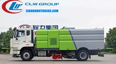 Side view of the road sweeper showing stainless steel dustbin and vacuum inlet at the rear