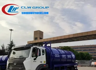 Rear view of the HOWO vacuum sewage tanker showing the hydraulic lift and discharge port