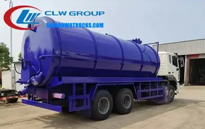 Side view of the cesspit truck with the 6 metre suction tube extended and connected to a pit