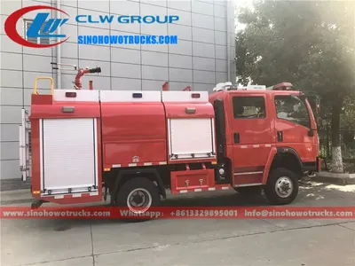 Side view of the fire truck with open roller shutter lockers and foam tank access door