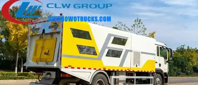 Side view of the HOWO road sweeper showing stainless steel garbage and water tanks