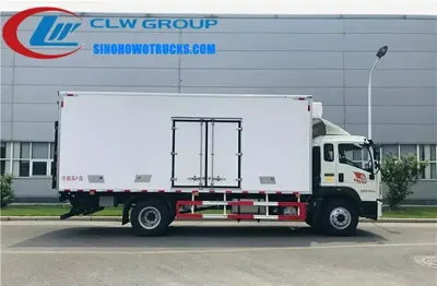 Interior view of the freezer truck showing multi-temperature partition, stainless steel hooks, and aluminium rails