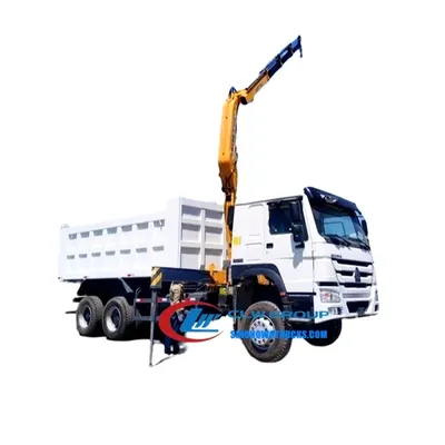 Side view of the HOWO tipper truck with crane showing the Q345 dump body and crane boom