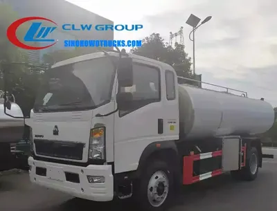 Side view of the HOWO milk truck showing four internal compartments and stainless steel piping