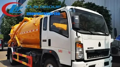 Front view of the HOWO sewage truck showing cab, vacuum pump, and control panel