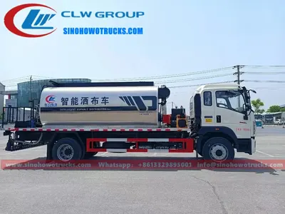 Side view of the HOWO asphalt spreader showing the 2 to 6 metre adjustable spray width