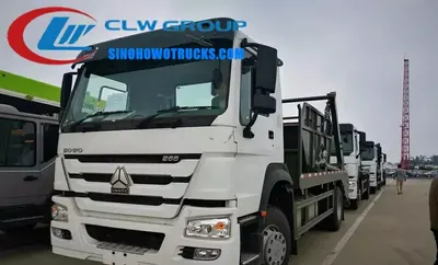 Sinotruk HOWO 6x4 10m3 skip lorry in urban waste collection setting with swing arm lifting a sealed skip body