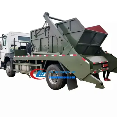 Rear view of the skip lorry with the swing arm in the raised position and the skip body detached