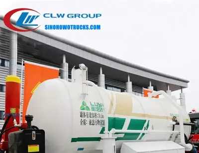 Sinotruk HOWO 12000 litre sludge truck in Djibouti with cylindrical tank and front-mounted vacuum pump