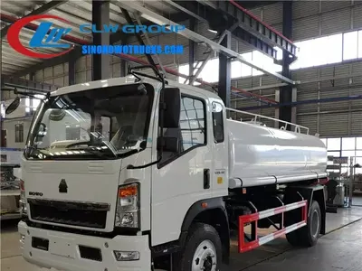 Side view of the HOWO water truck showing the 12000 L tank and high cannon on rear platform