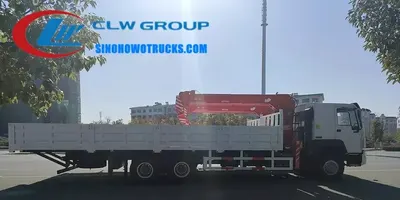 Rear view of the truck crane with the cargo body and crane base mounted on the high-strength chassis