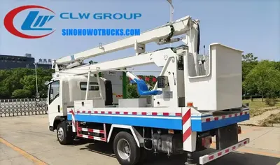 Side view of the HOWO aerial lift truck showing the 4 hydraulic outriggers and 360 degree rotation capability