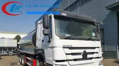 Rear view of the asphalt lorry with the computer control panel and spray nozzles visible