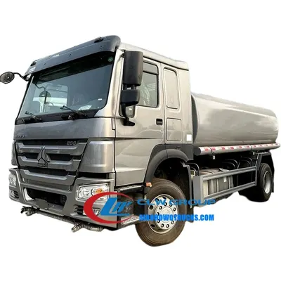 Side view of the HOWO water tanker with spray nozzles and tank access manhole