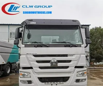Sinotruk HOWO 16 ton truck mounted sweeping machine in city street cleaning operation with dustbin and brooms in use