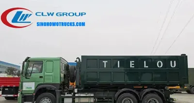 Rear view of the HOWO roll off truck showing the hook lift system and hydraulic cylinders