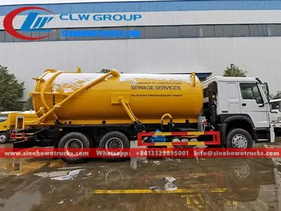 Rear view of the HOWO sewage tanker showing hydraulic lift and vacuum pump system