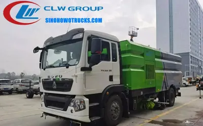 Side view of the HOWO sweeper with sweeping brooms and vacuum nozzles in operation
