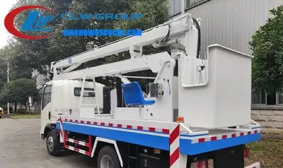 Sinotruk HOWO 16 meter boom lift truck in urban setting with telescopic boom extended and work basket at height