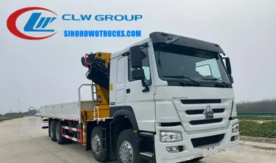 Sinotruk HOWO 16t knuckle boom crane truck in service in Guinea Bissau with crane extended and boom at full reach