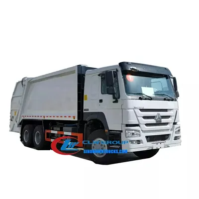 Rear view of the HOWO waste truck with compaction body and dual sewage tanks