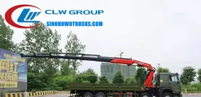 Side view of the HOWO truck mounted crane showing the 6x4 chassis and knuckle boom structure