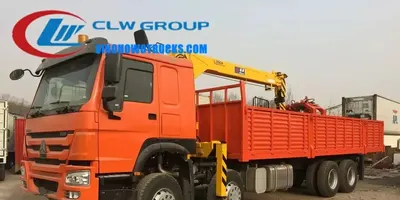 Sinotruk HOWO 18 ton telescopic truck mounted crane with grabber in operation at a construction site