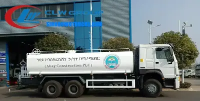 Rear view of the HOWO water tanker showing the water cannon and high reach spray platform