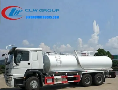 Side view of the HOWO septic truck showing the 100 mm suction tube and control panel