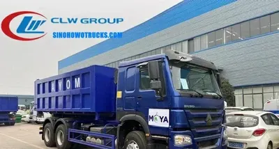 Rear view of the HOWO hook loader showing the hydraulic outrigger and container lift arm