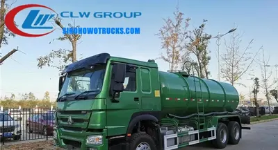 SINOTRUK Howo 18CBM sewage cleaning tanker in service with tailgate fully open and suction hose deployed