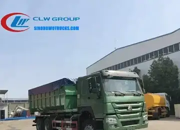 Sinotruk HOWO 6x4 roll off garbage truck in standard grey with 20m3 container mounted on hook loader system