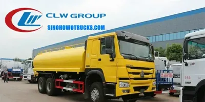 Side view of the water tank truck showing spray nozzles and tank access manhole