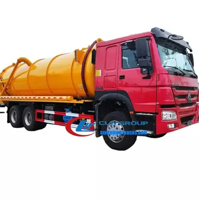 Rear view of the vacuum truck with the fully open tailgate and air blowdown system in use
