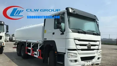 Rear view of the water tanker with high cannon and spray nozzles in operation