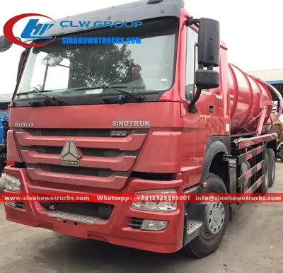 Side view of the HOWO sewage truck showing suction hose, control panel, and hydraulic pump