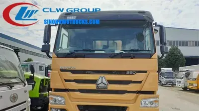 Sinotruk HOWO 6x4 bitumen chip sealer truck with integrated spray and spread system in standard road maintenance livery