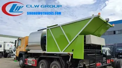 Rear view of the chip sealer truck showing the 8000 L aggregate tank and bitumen spray nozzles
