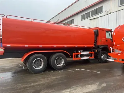Side view of the HOWO water bowser truck showing front and side spray nozzles
