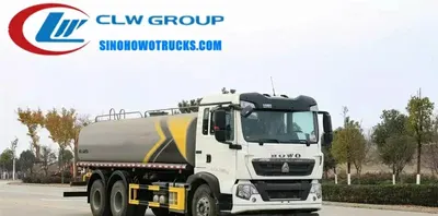 Side view of the HOWO water truck showing aluminium alloy fuel tank and roller shutter access doors