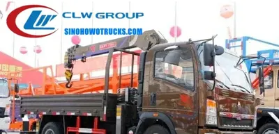 Sinotruk HOWO 3 ton small truck crane in Cote d’Ivoire with telescopic boom extended and cargo box loaded