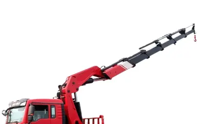 Rear view of the HOWO crane truck with the crane mounted on the subframe and control panel visible