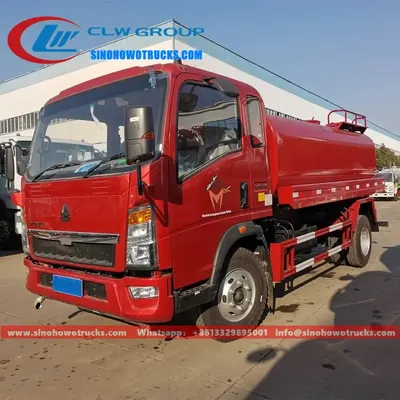 Rear view of the HOWO water truck showing the water cannon and spray platform