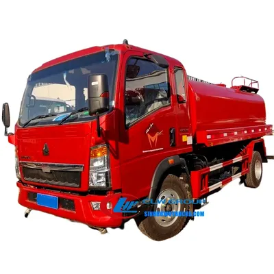 Side view of the HOWO water tanker with spray nozzles and tank access manhole