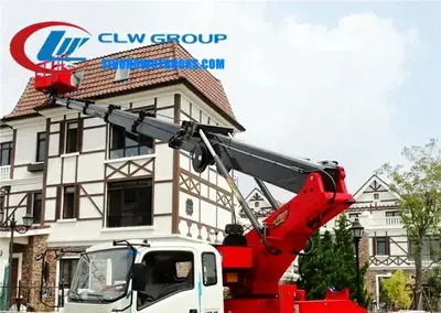 Side view of the HOWO aerial lift truck showing the H-type outriggers and hydraulic cylinders