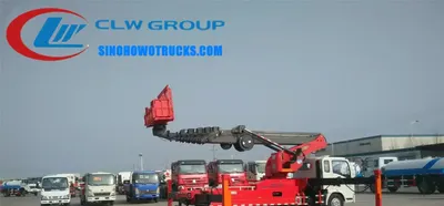 Sinotruk HOWO 32 metre aerial lift truck with telescopic boom extended and basket at height