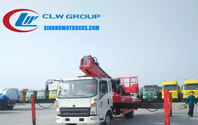 Side view of the HOWO aerial lift truck showing hydraulic outriggers and basket