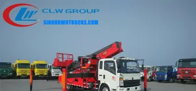 Rear view of the HOWO man lift truck with boom retracted and cab visible